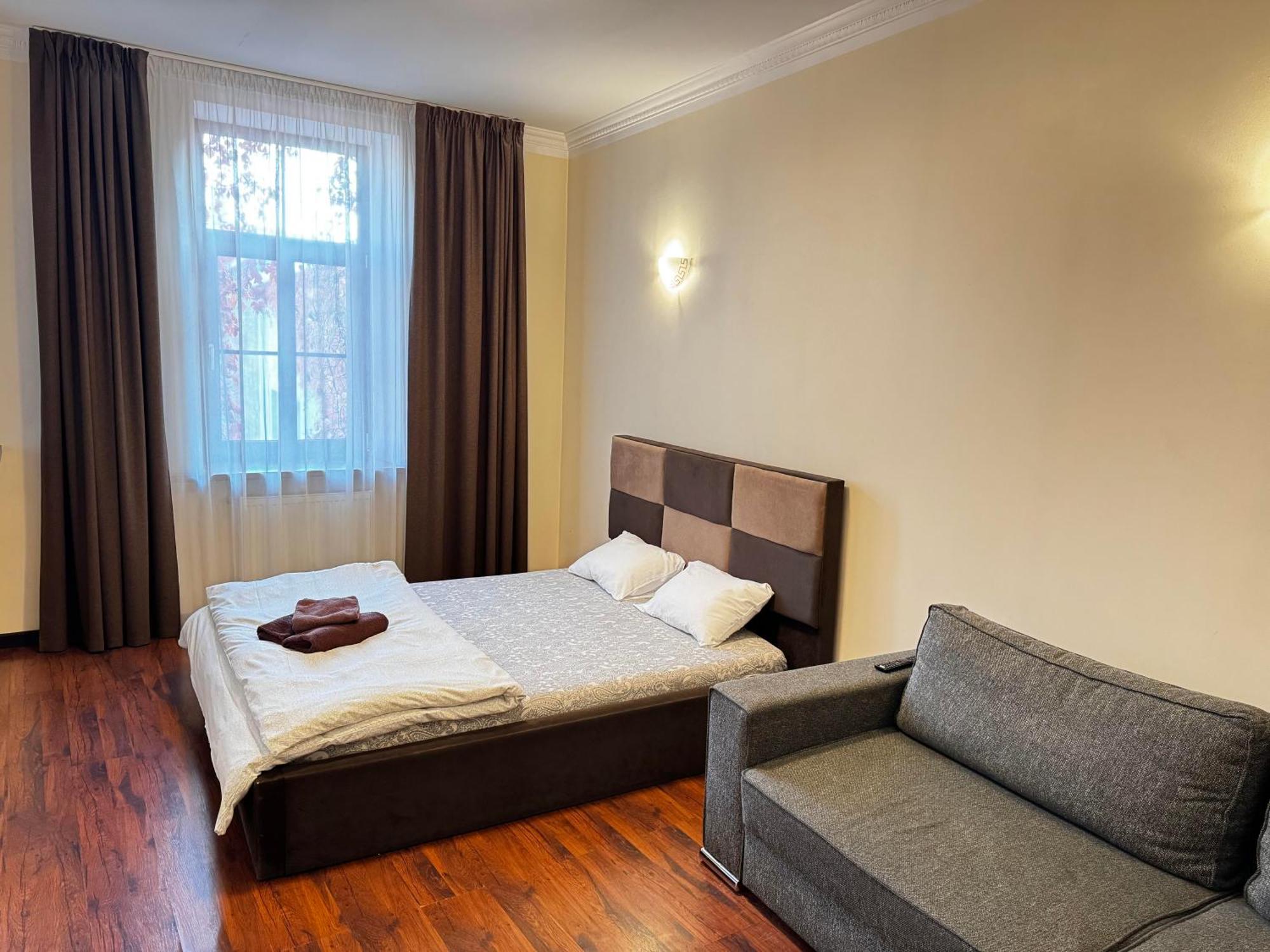Aparthotel รีกา ภายนอก รูปภาพ A bedroom in a hotel