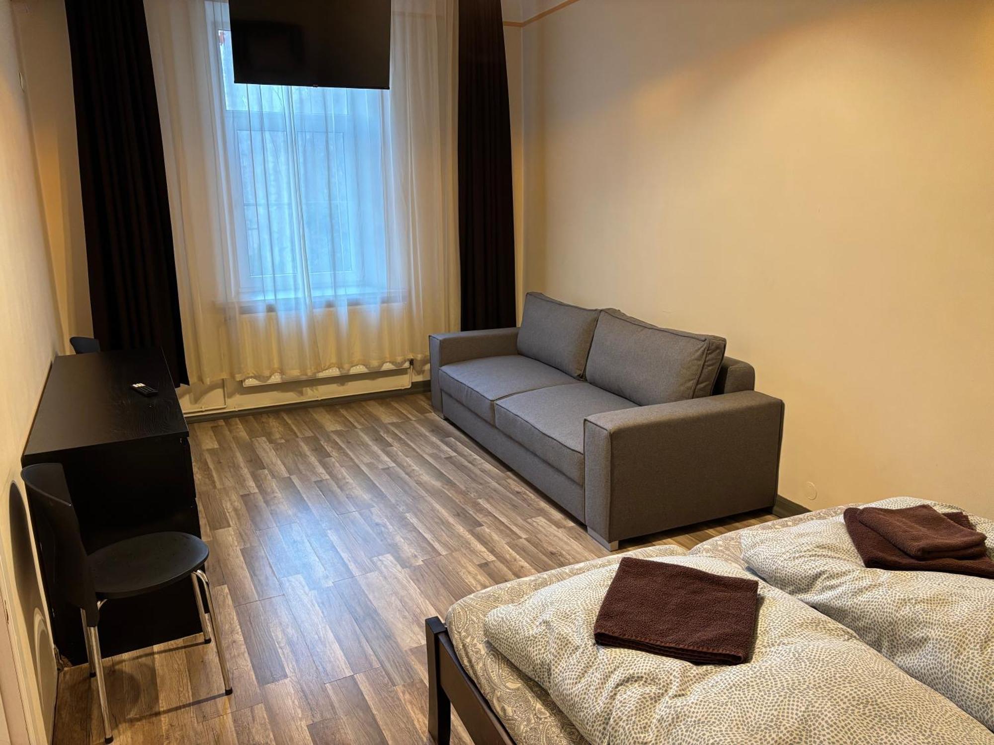 Aparthotel รีกา ภายนอก รูปภาพ A typical room at the hostel