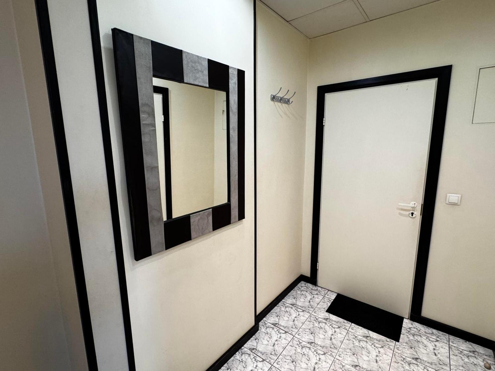 Aparthotel รีกา ภายนอก รูปภาพ A mirror in a bathroom